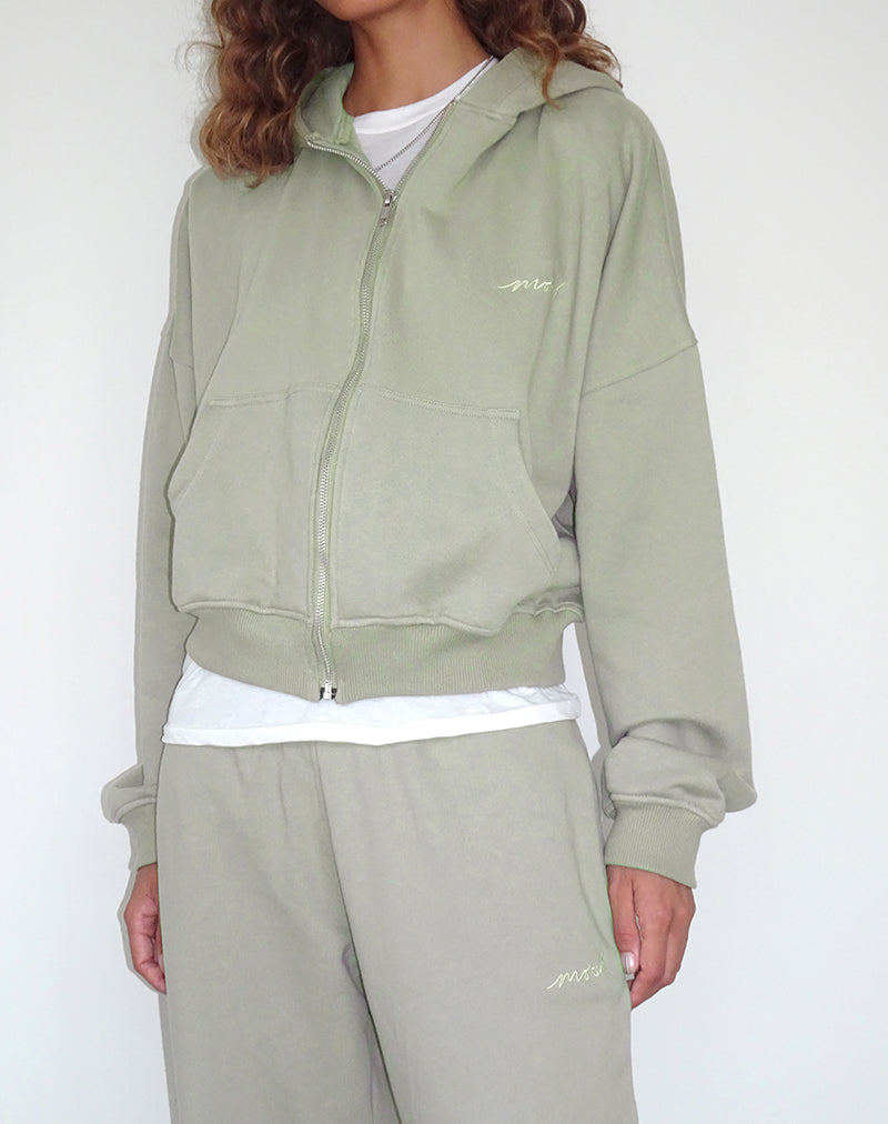 Immagine del maglione con zip in London Fog con ricamo 'MOTEL' in avorio
