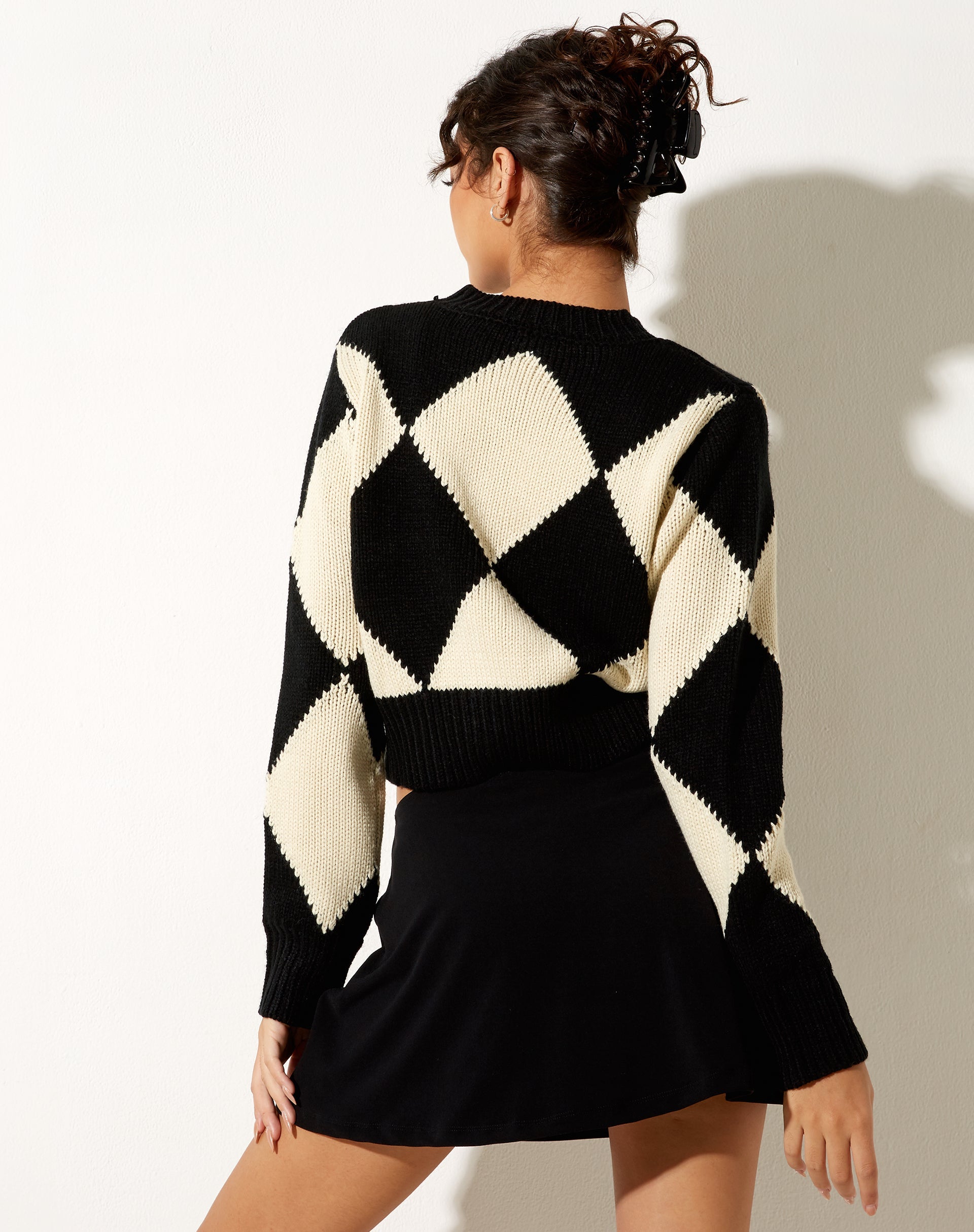 Immagine del maglione Binda in nero arlecchino e bianco sporco
