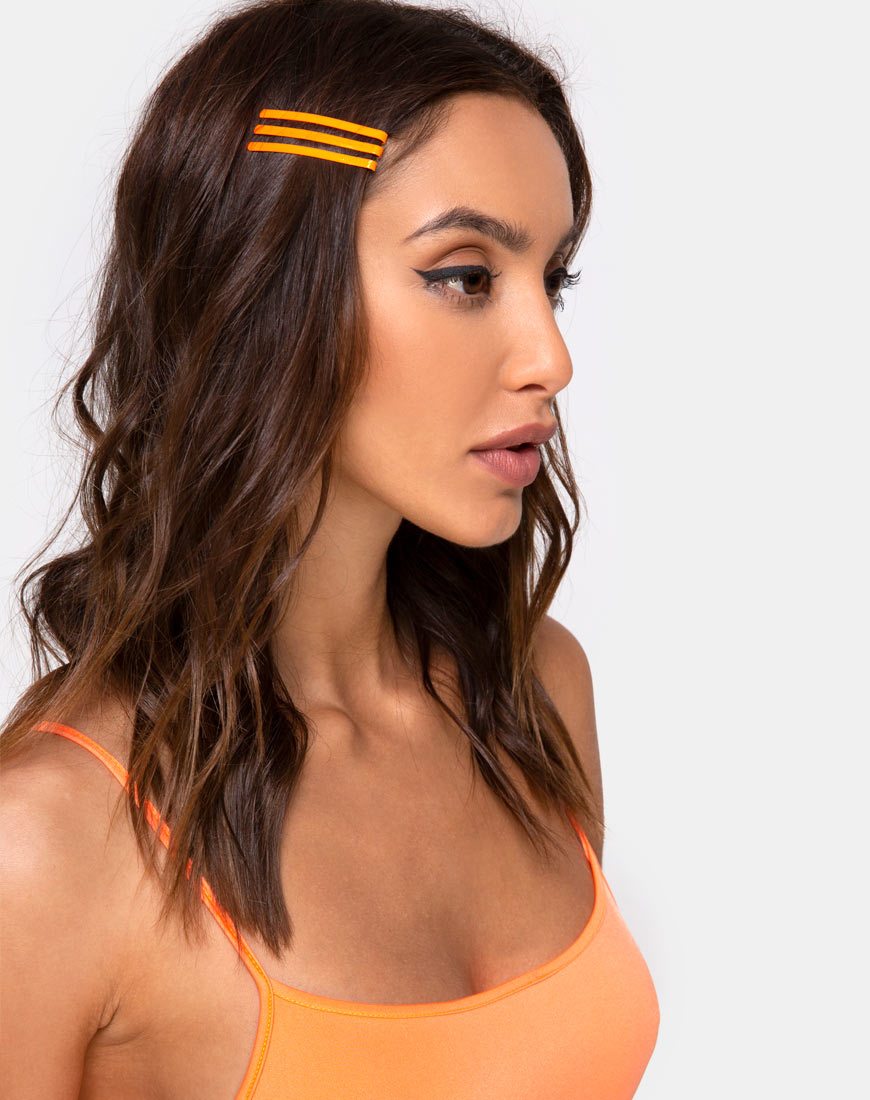 Immagine del set di fermagli per capelli al neon in arancione