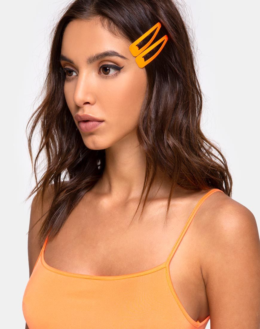 Immagine del set di fermagli per capelli al neon in arancione