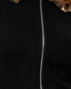 Nero con animale marrone