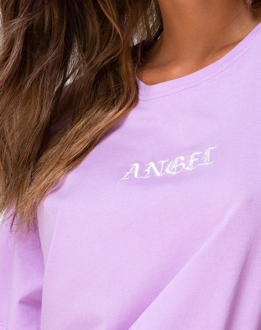 Immagine della t-shirt basic oversize in lilla con ricamo a forma di angelo