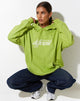 immagine della felpa con cappuccio oversize in verde foglia con diversi ricami in bianco