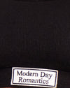 Etichetta nera con etichetta Modern Day Romantics Embro