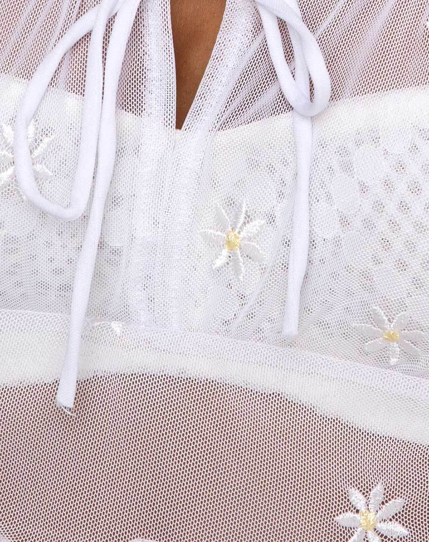 Top Salima a maniche lunghe in bianco con ricamo a margherita bianco