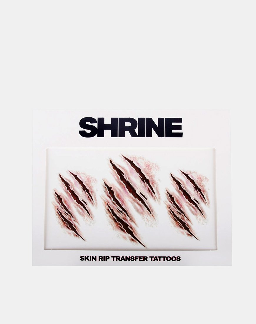Immagine di Skin Rip Transfer Tattoo by Shrine