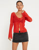immagine di Sujata Cardi in rosso