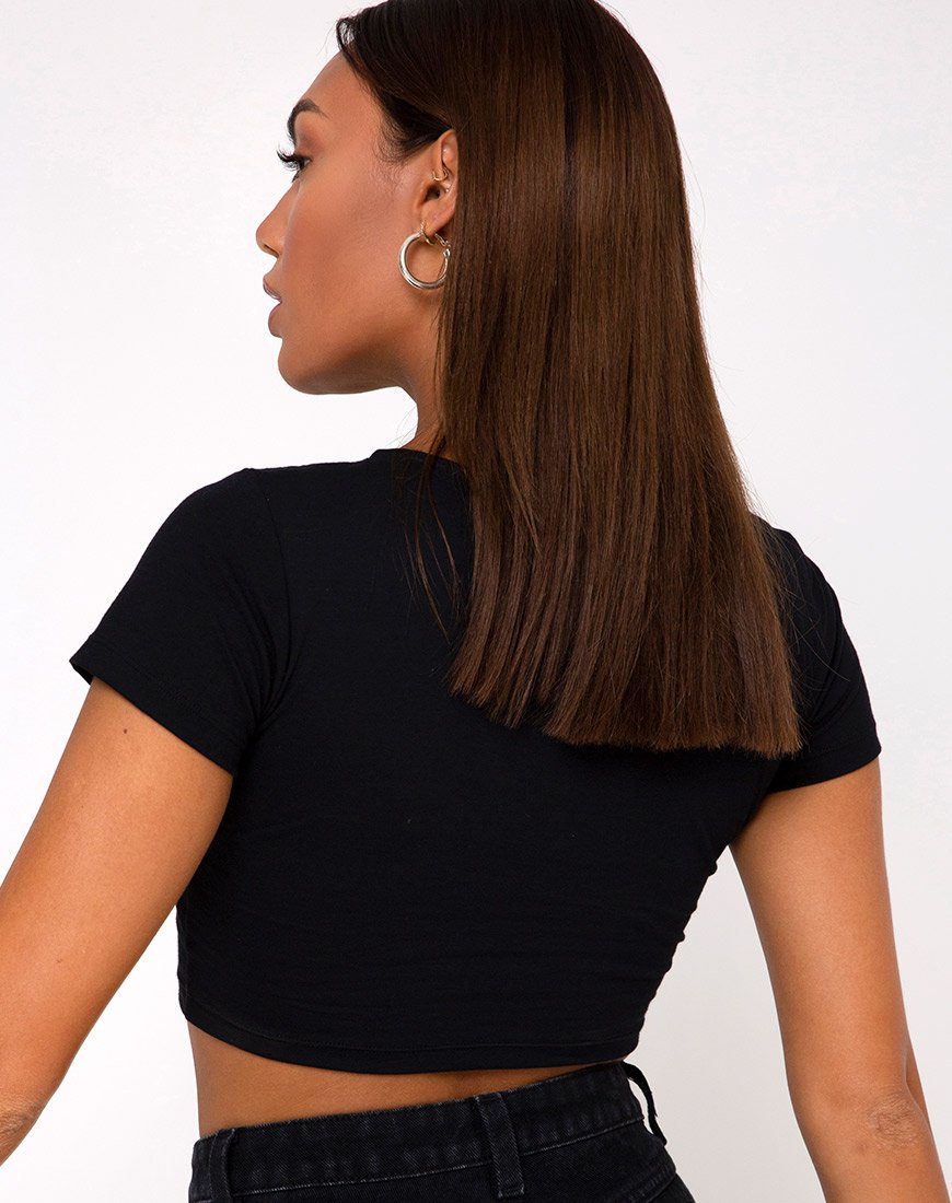 Top Tindy nero con charm nascosto