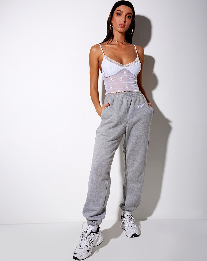 Immagine di Yenika Crop Top con ricamo a margherita bianco e pizzo bianco